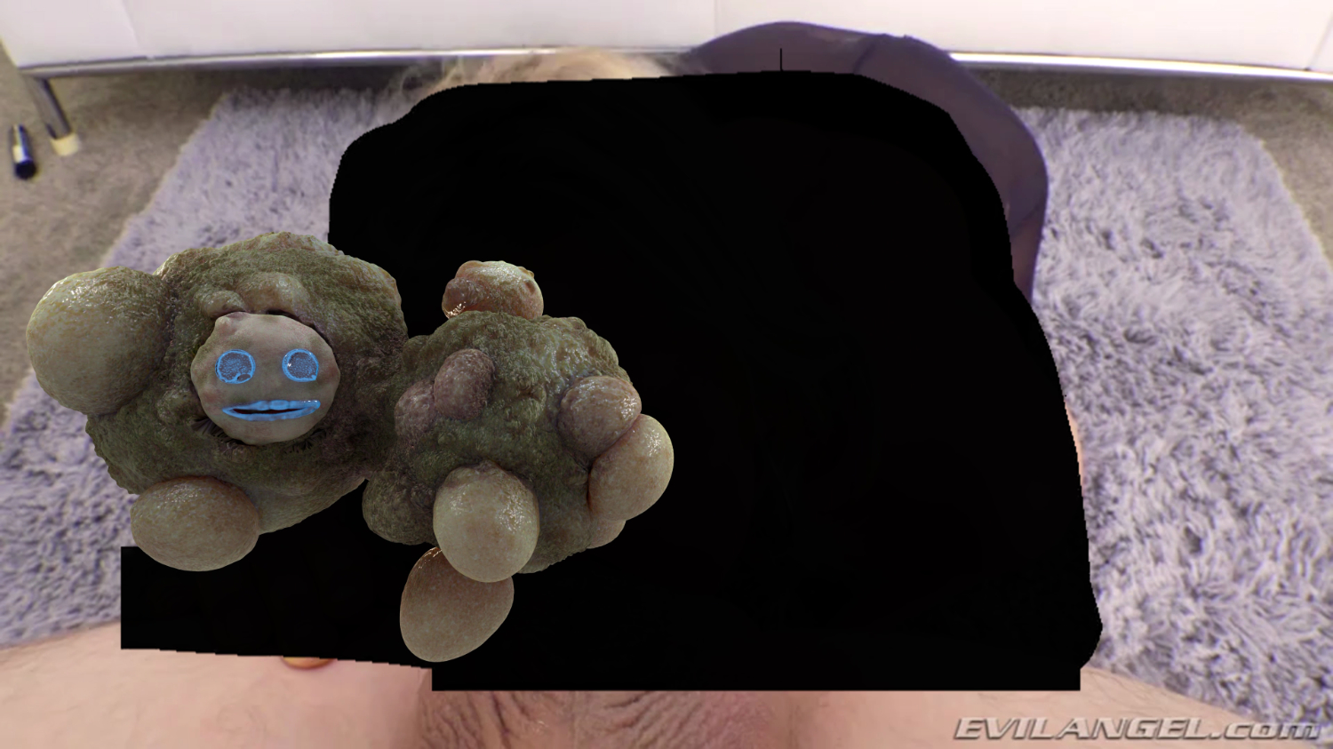 An image of a purple shag rug, atop which an image has been censored by a large black water-mark. At the veyr bottom of the image skin and tthe bottom section of a scrotum are visible. At the center left of the image is a digitally-rendered bulbous entity with a face.